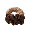 A headband made of satin fabric in shades of beige and brown, used for heatless curling.