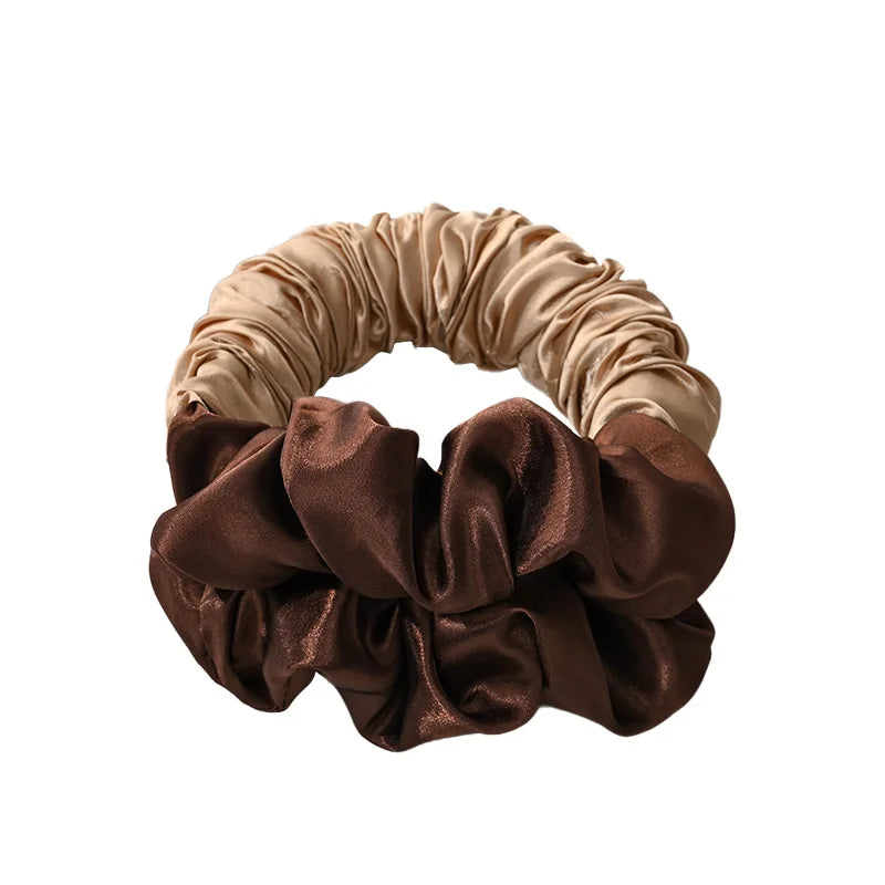 A headband made of satin fabric in shades of beige and brown, used for heatless curling.