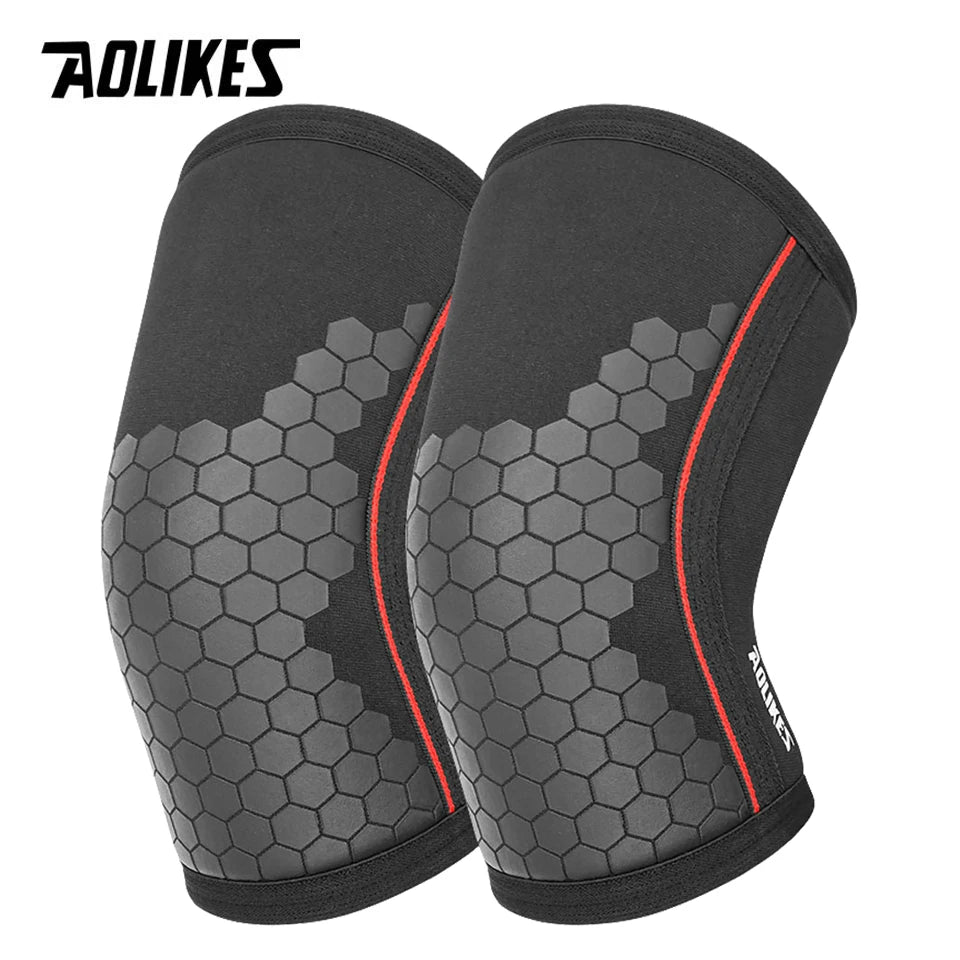 A pair of black knee sleeves for weightlifting and squats shown from the side.