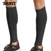 Black compression leg sleeves worn by a person, showing the full length of the garment.