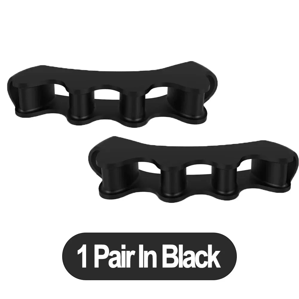 A pair of black silicone toe separator and foot straightener tools.
