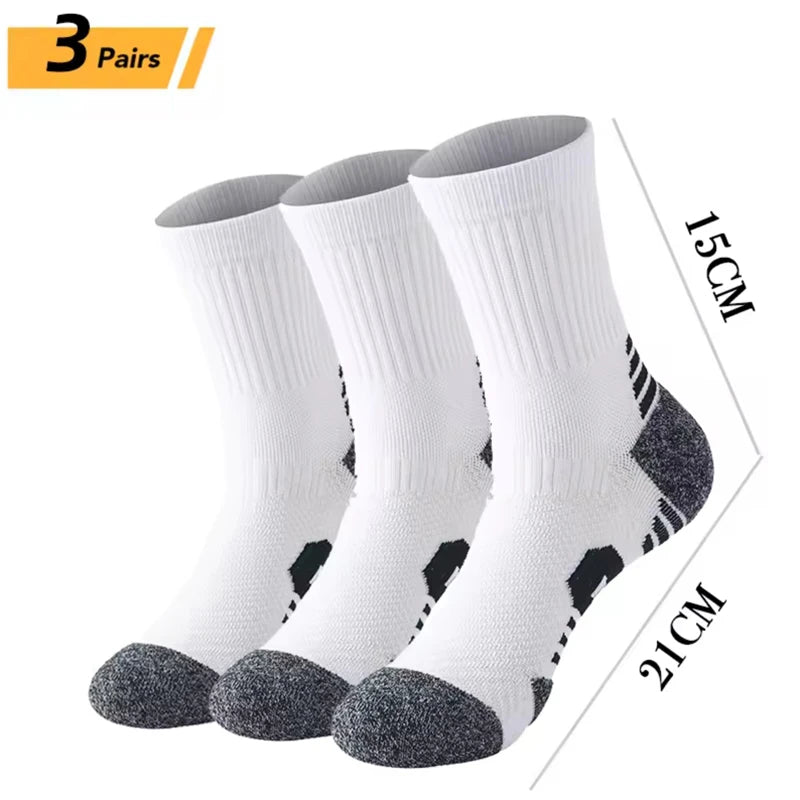 Three pairs of white and black performance running socks displayed vertically.
