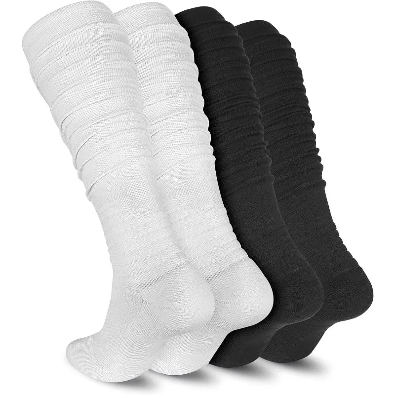 A stack of extra long black and white football socks for men