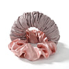 A headband made of draped, silky fabric in shades of mauve and dusty rose.
