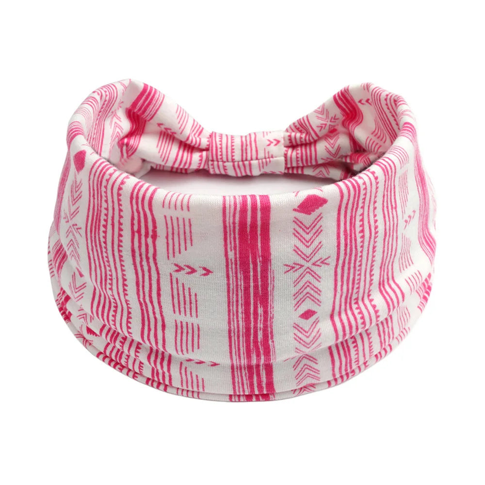 Pink and white striped bohemian cotton stretch headbands tied in a bow