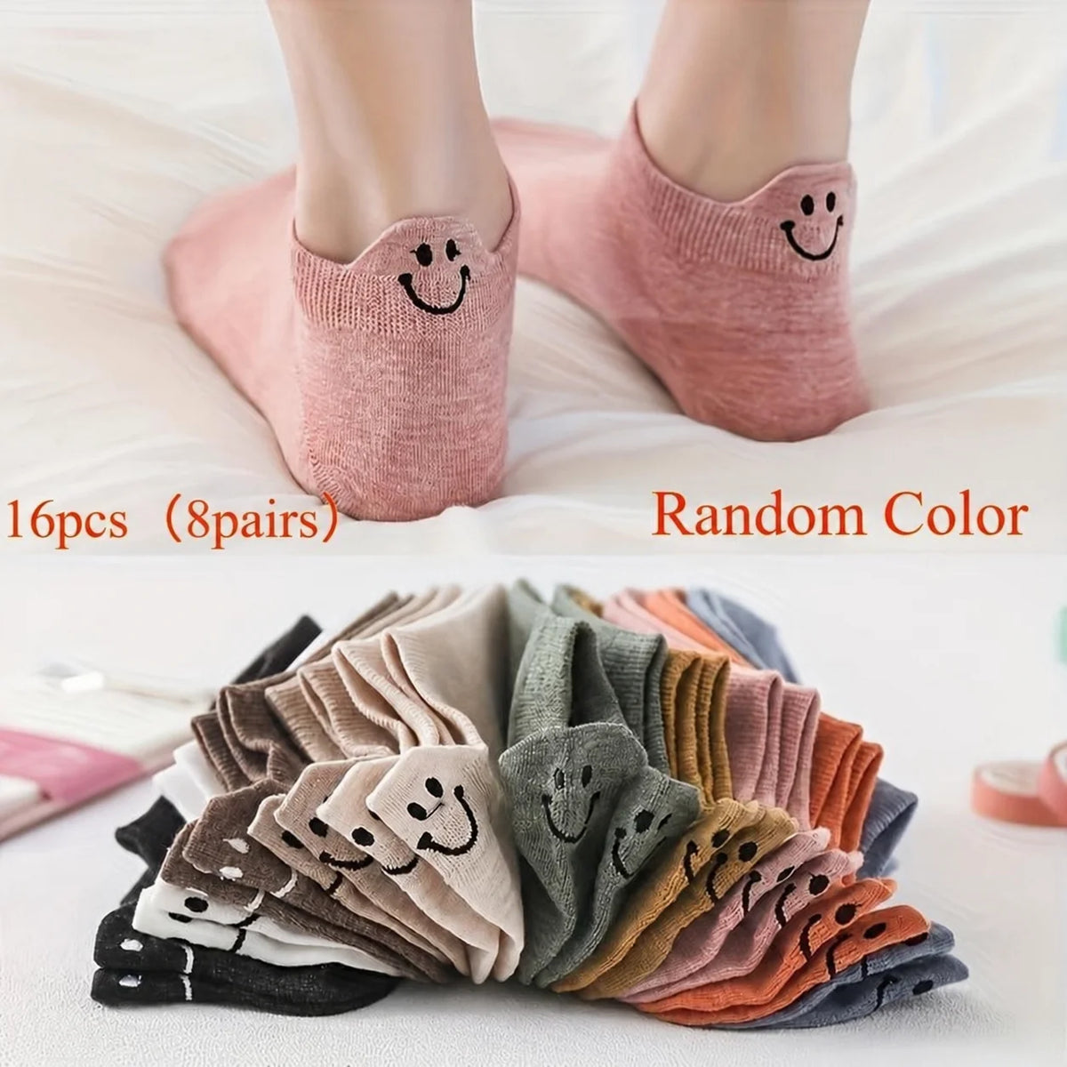 A collection of 16 pairs of low-cut ankle socks with smiling embroidery in various random colors.