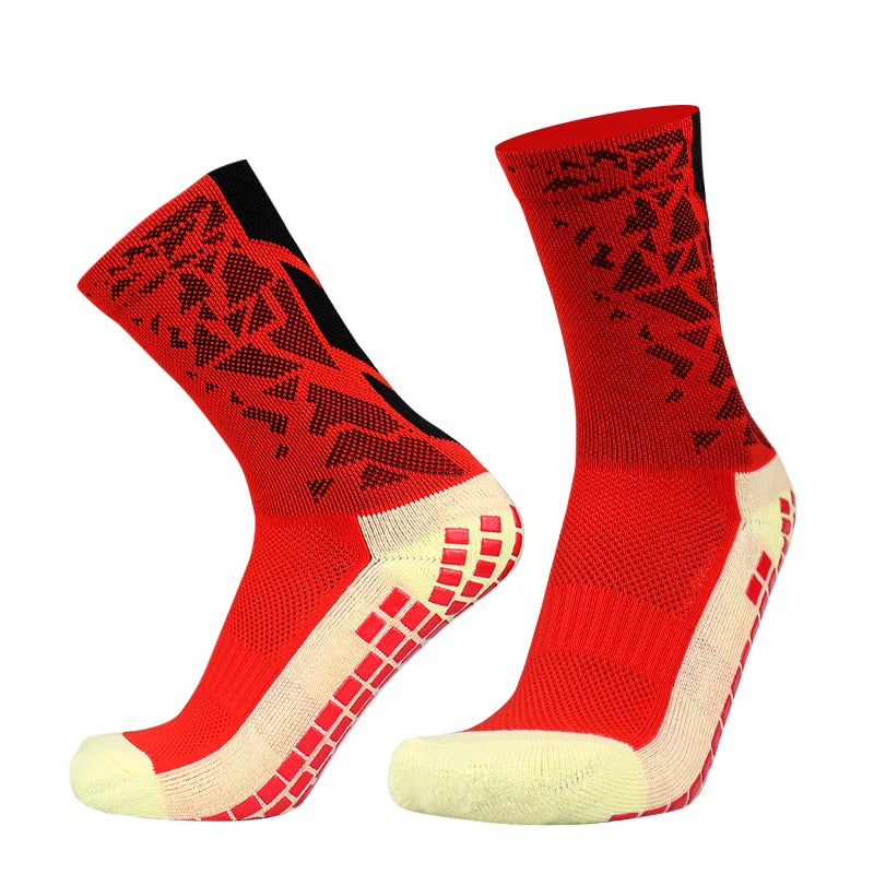 A pair of red and black patterned anti-slip silicone football socks shown from the side.
