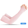A hand wearing a light pink UV protection arm sleeve, demonstrating the fit and use for outdoor activities.