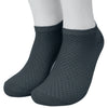 A pair of dark gray bamboo fibre anti-odor socks worn on a person's foot.