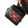 Black heavy-duty weightlifting wrist straps with a red crossed design shown on a hand.