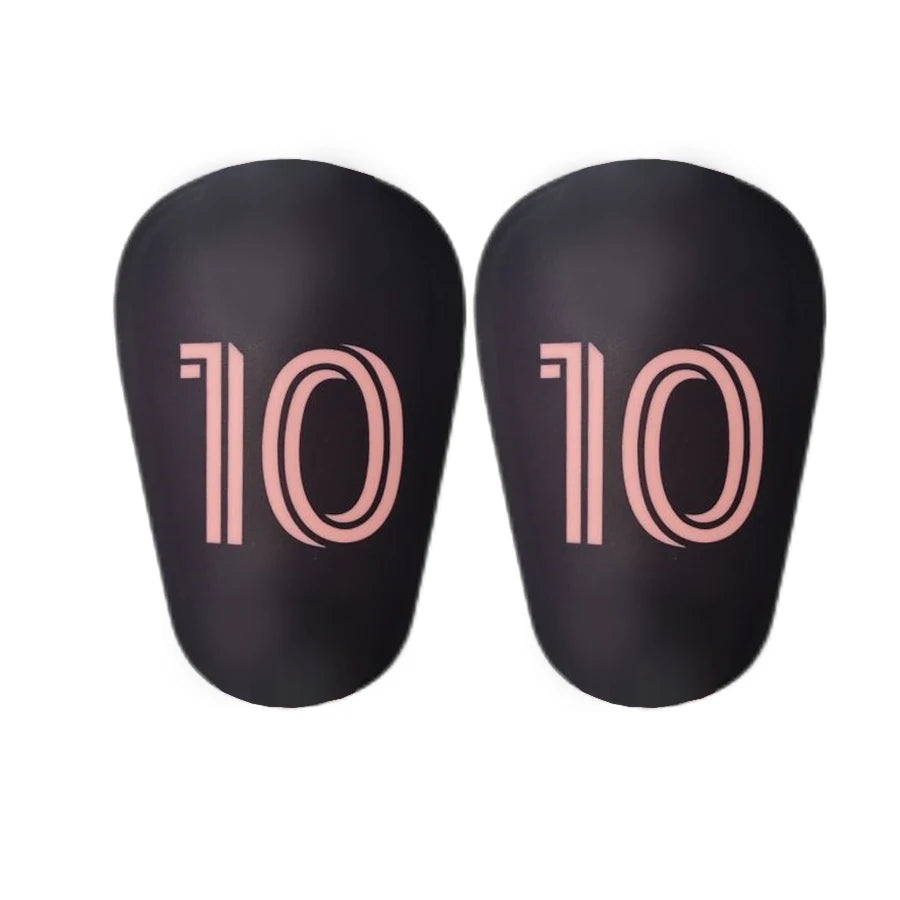 A pair of black mini football shin guards for youth and adult players.