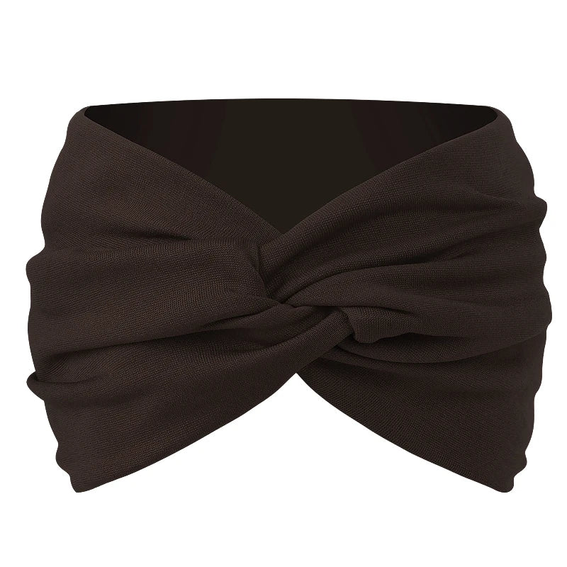 A dark brown twisted criss cross elastic headband for yoga and sports.