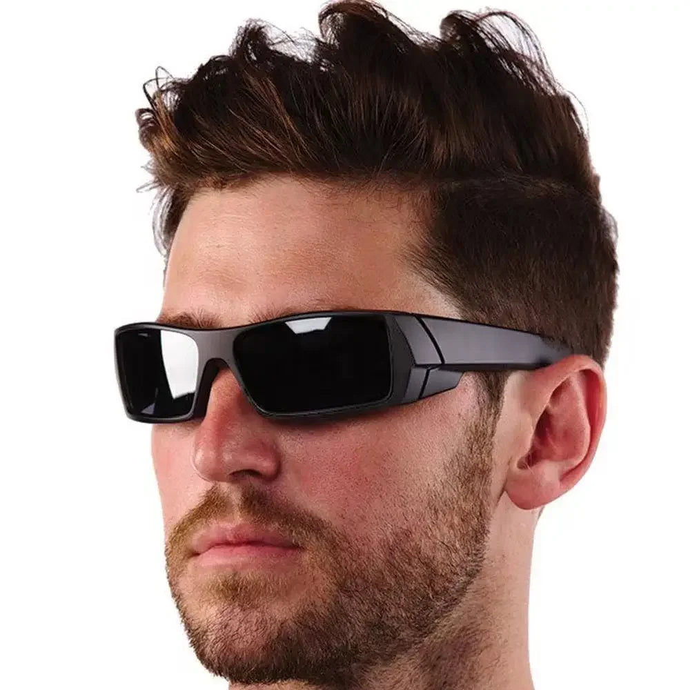 A man wearing black polarized cycling and driving sunglasses.