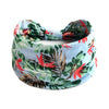 A floral patterned cotton stretch headband featuring red and green leaves.