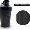 A black leak-proof shaker bottle with a non-slip pattern for easy grip.