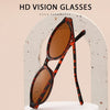 A pair of tortoiseshell patterned sunglasses with an oval frame displayed against a light background.