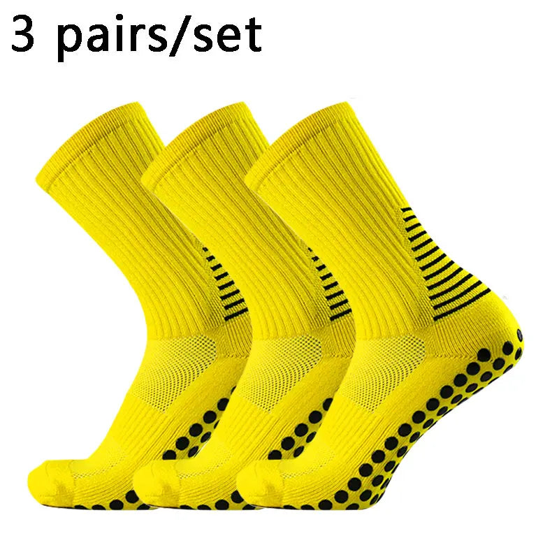 Three pairs of bright yellow performance football socks for training and match