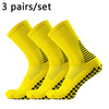 Three pairs of bright yellow performance football socks for training and match