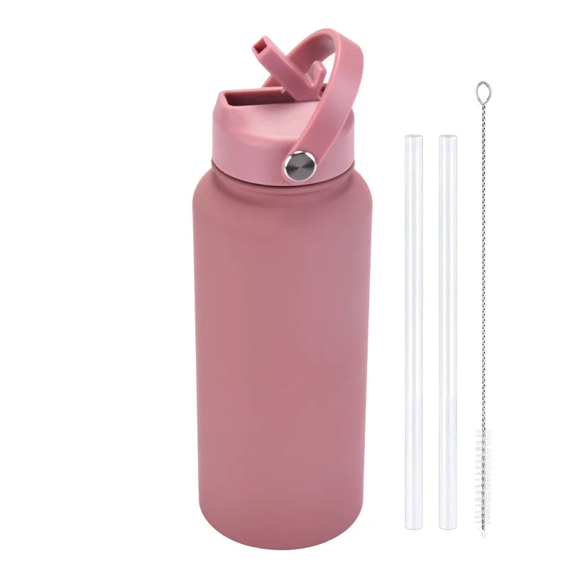 A pink stainless steel vacuum flask water bottle with a hinged straw cap and separate straw.