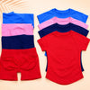 A set of seamless high-waist yoga tops and bottoms in various shades of blue, pink, and red.