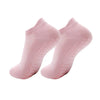 A pair of light pink women's yoga and fitness socks shown from above.