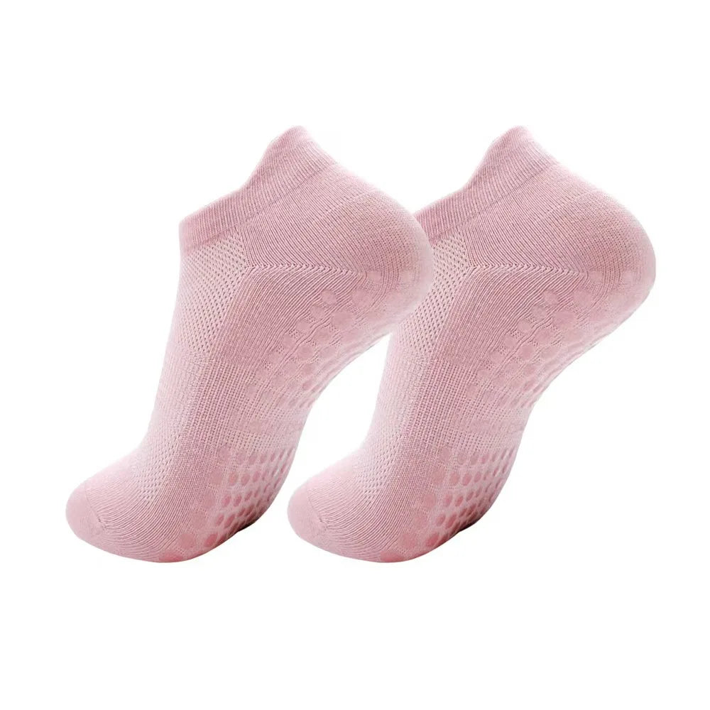 A pair of light pink women's yoga and fitness socks shown from above.