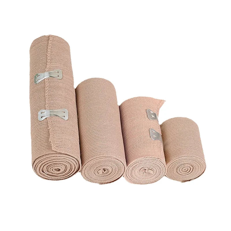 A set of four beige elastic tendon bandages rolled into cylinders with silver fasteners.