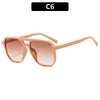 Vintage square sunglasses with a double bridge in a light brown or rose gold frame.