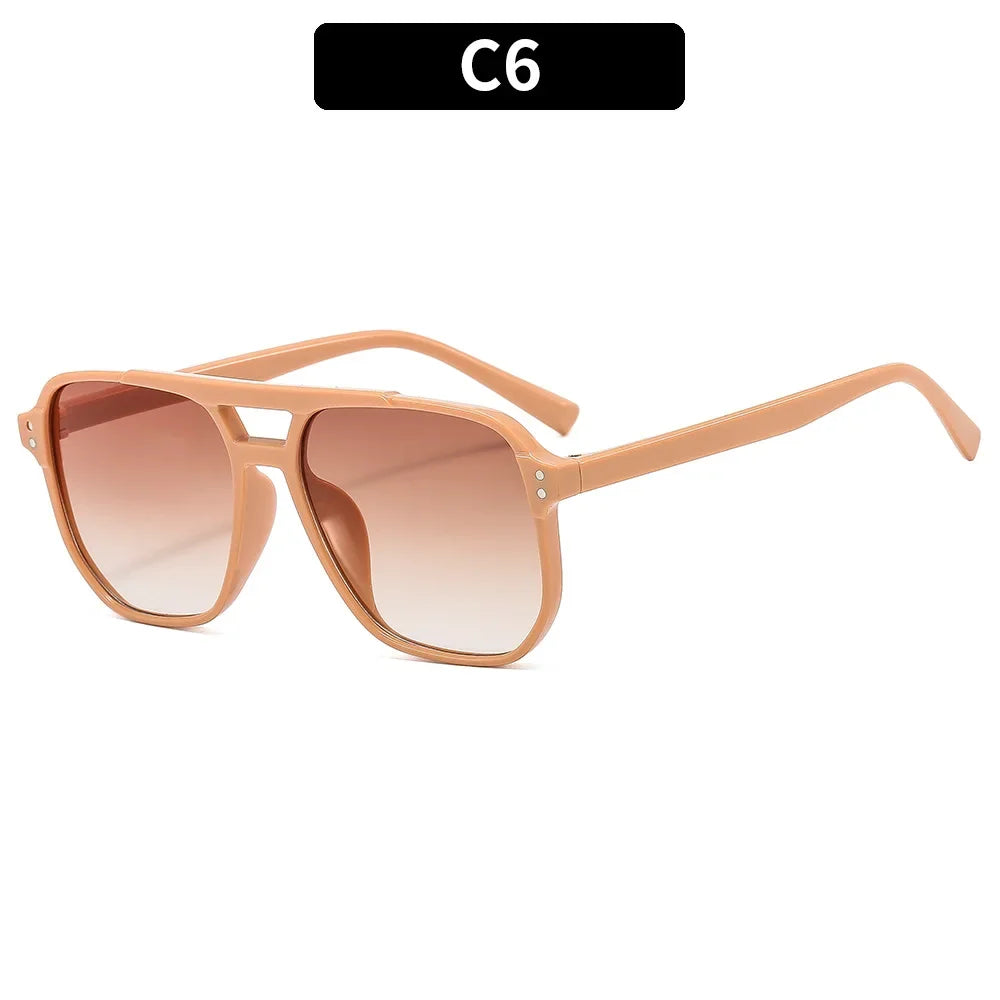 Vintage square sunglasses with a double bridge in a light brown or rose gold frame.