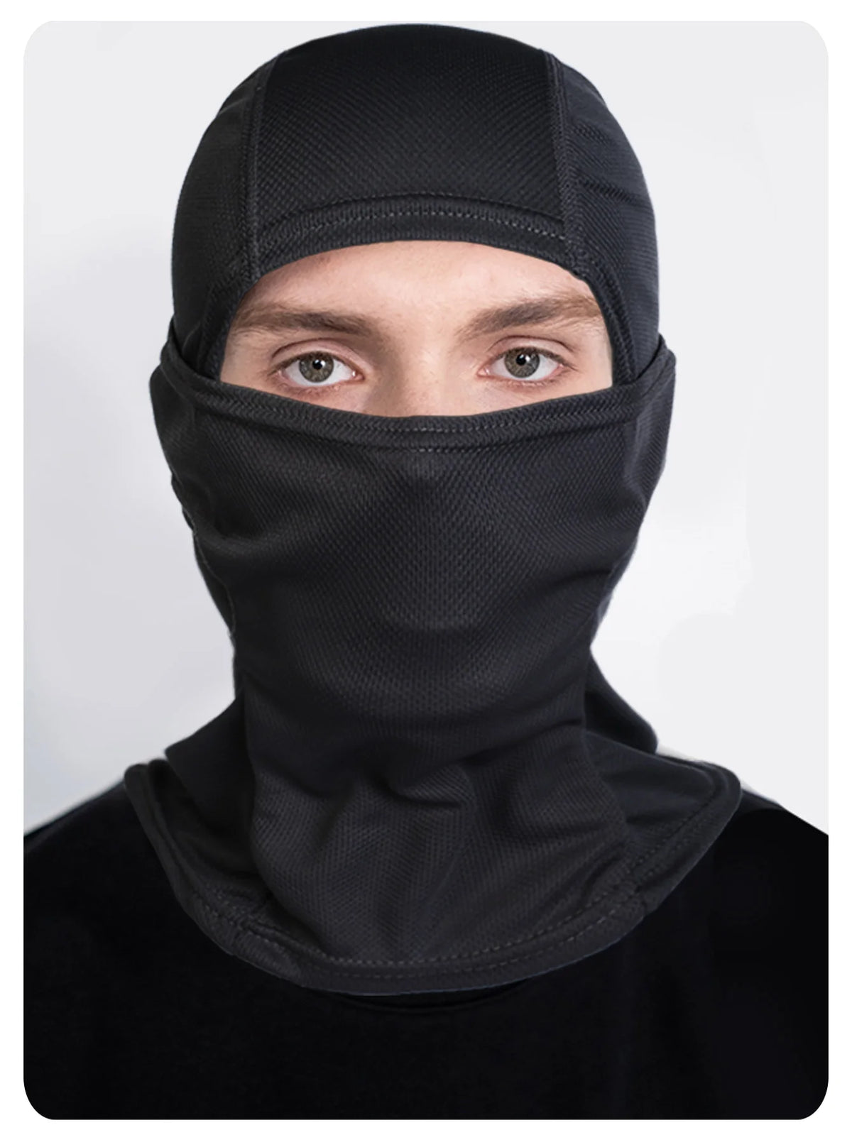 A man wearing a black breathable mesh balaclava face mask covering his head and lower face.