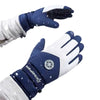 A close-up view of a dark blue and white waterproof touchscreen ski glove being worn in winter conditions.