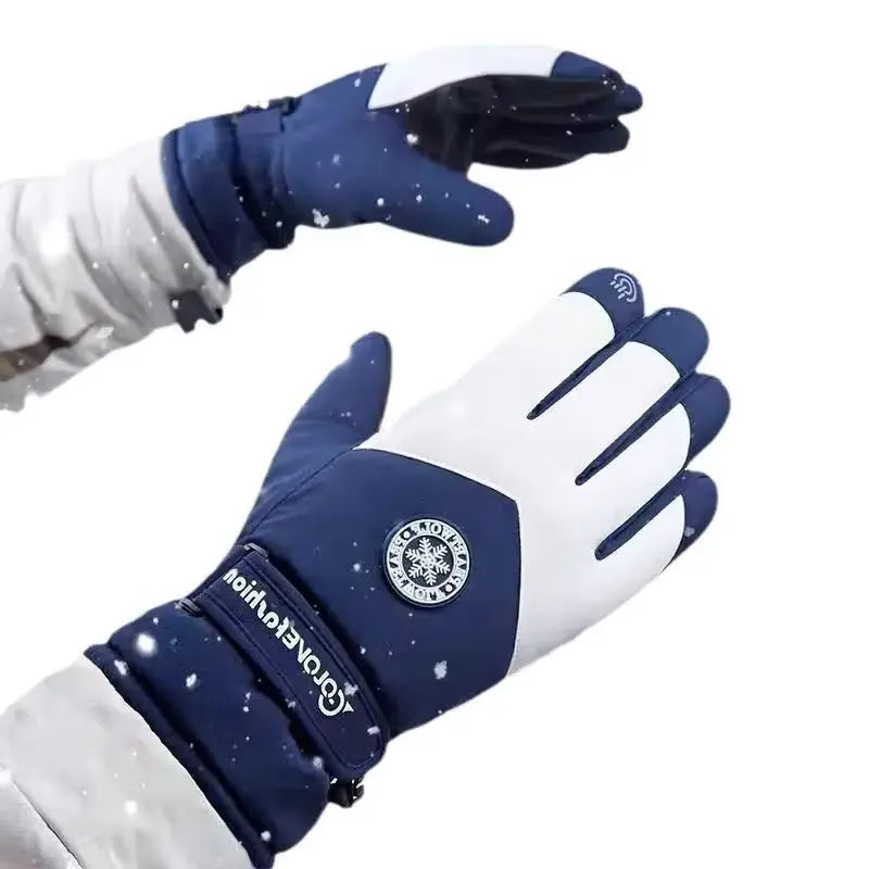 A close-up view of a dark blue and white waterproof touchscreen ski glove being worn in winter conditions.