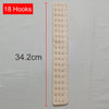 A long, light-colored fabric strip with eighteen hooks is shown next to a measurement scale.