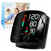 Black digital wrist blood pressure monitor displaying 120/80 mmHg and heart rate, shown next to its box.