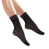Paar schwarze florale Spitzen-dünne Socken auf einer Mannequinbeine.