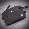 A black slim RFID blocking wallet with a zipper closure and strap is shown on a gray background.