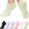 A multi-pack of light green women's yoga and fitness socks shown from the sole view.
