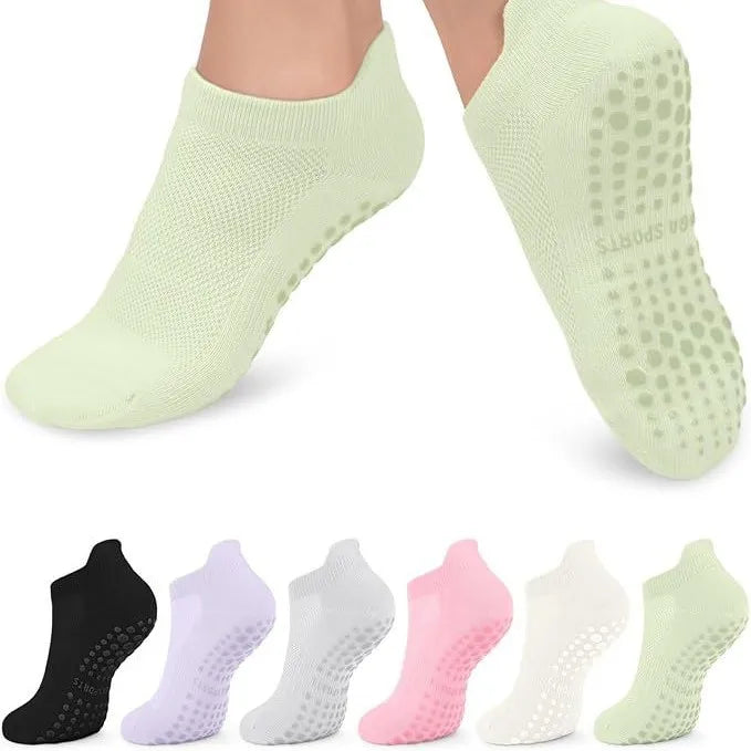A multi-pack of light green women's yoga and fitness socks shown from the sole view.