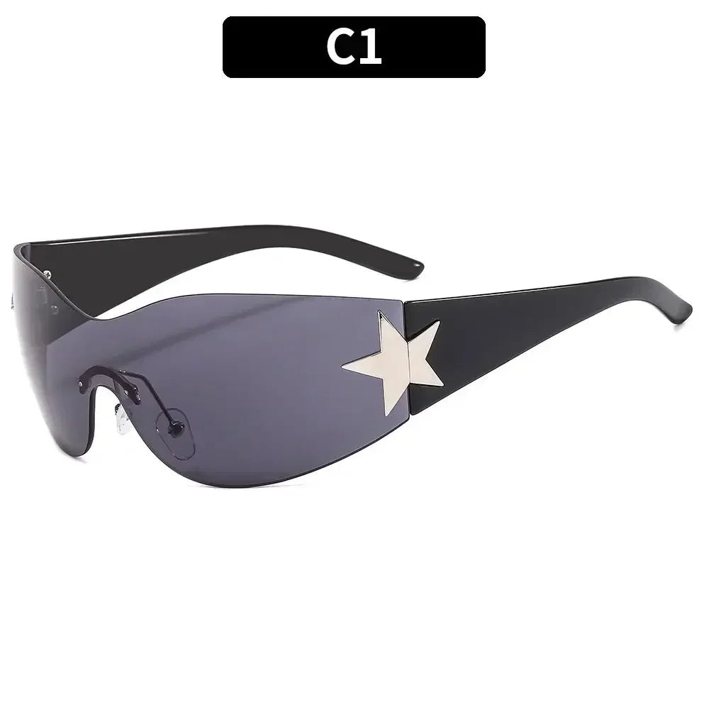 A pair of black sunglasses with a gradient lens and a gold star detail.