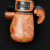 A pair of brown PU leather boxing gloves with a black strap and a leather patch featuring the Ginpal logo.