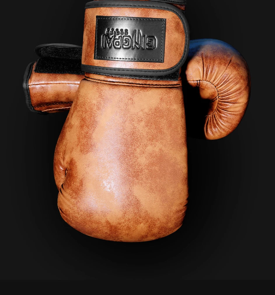 A pair of brown PU leather boxing gloves with a black strap and a leather patch featuring the Ginpal logo.