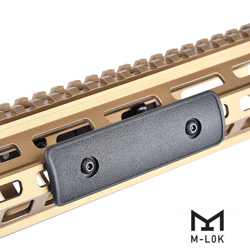 Close-up view of a tactical rail panel kit for airsoft guns featuring a black mounting plate on a tan polymer rail system.