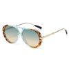 Vintage oversized designer sunglasses with tortoiseshell frames and gradient green lenses