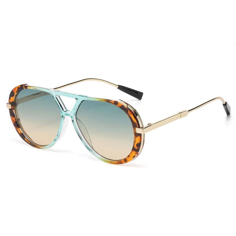 Vintage oversized designer sunglasses with tortoiseshell frames and gradient green lenses