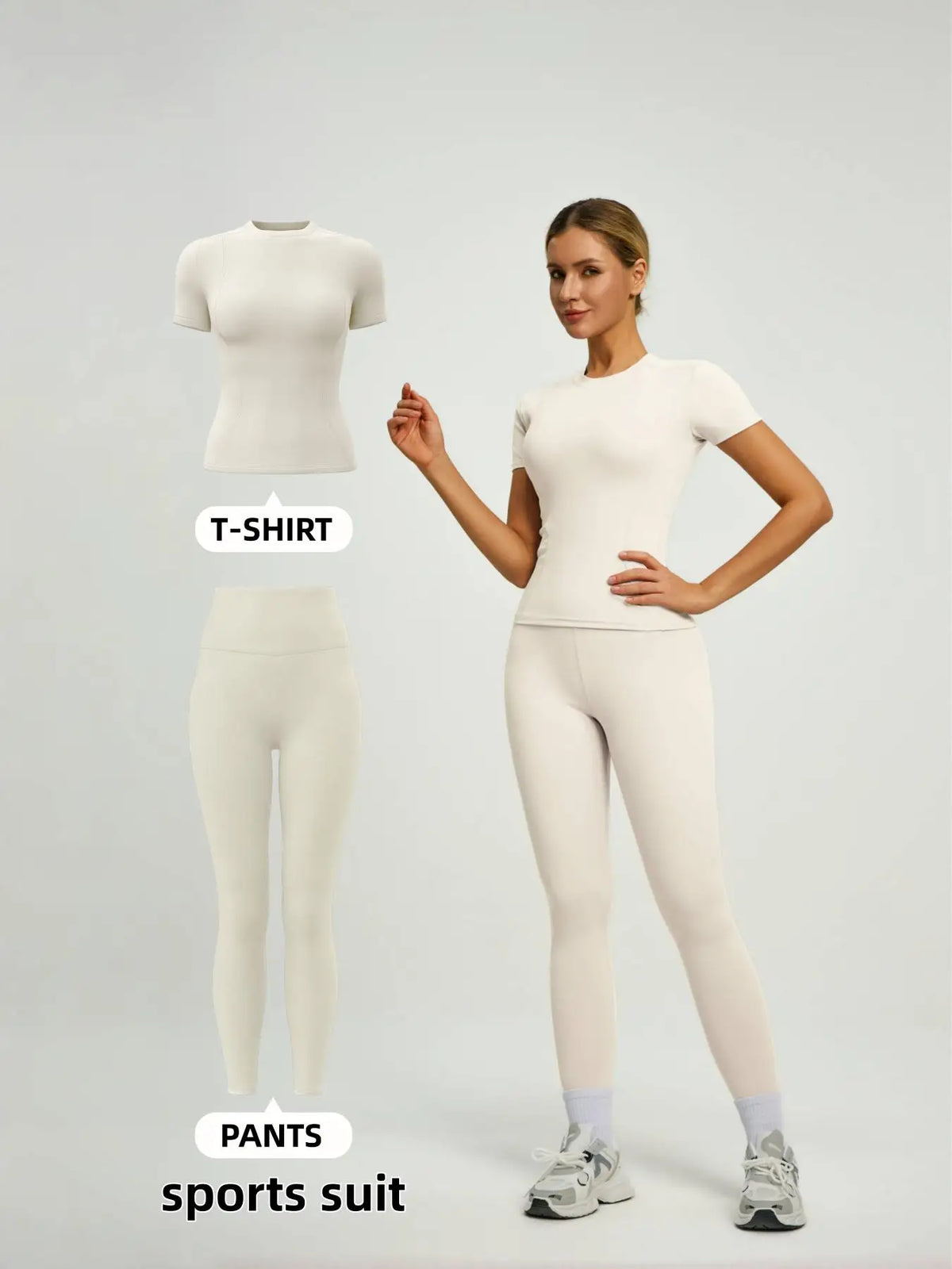 Model in cream sports suit with fitted t-shirt and matching pants.