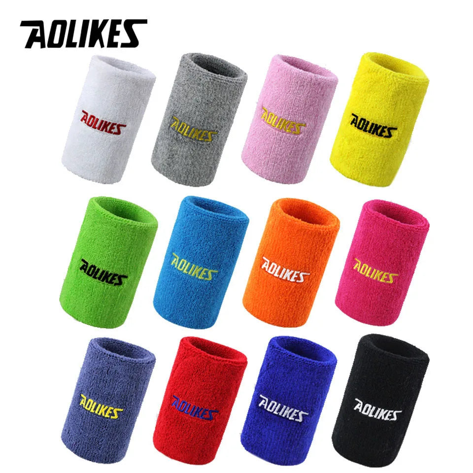 A collection of colorful and textured athletic wristbands in various colors including white, gray, pink, yellow, green, blue,