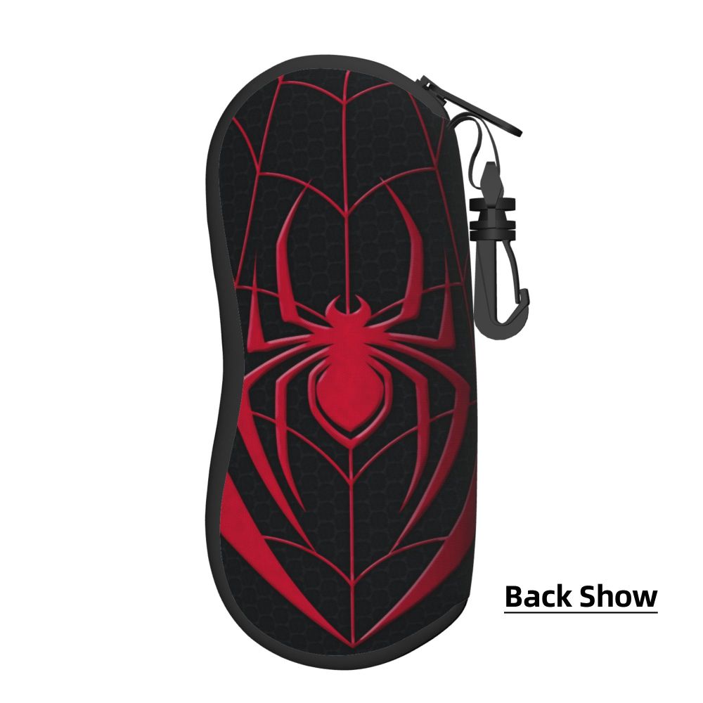 A black silicone pouch featuring a red spider web design and a black strap for holding.