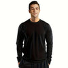 A male model wearing a black performance quick-dry long-sleeve shirt and black pants.