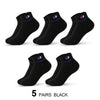 Five pairs of black ankle socks shown in a flat lay view.