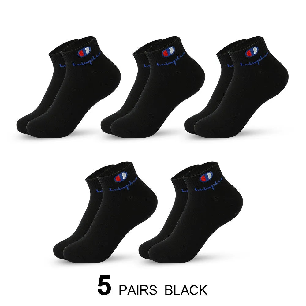 Five pairs of black ankle socks shown in a flat lay view.